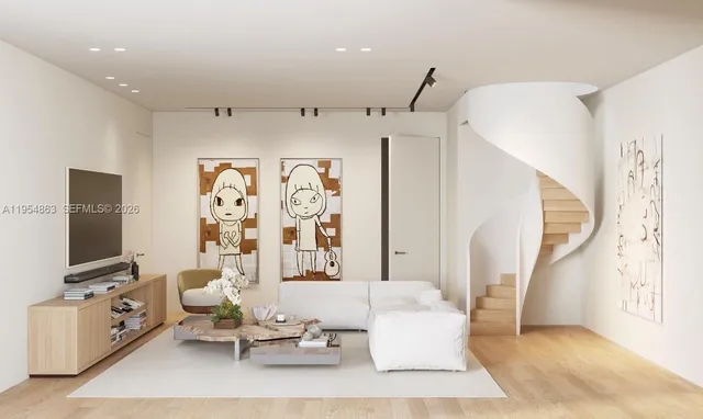 a living room with furniture a flat screen tv and a window