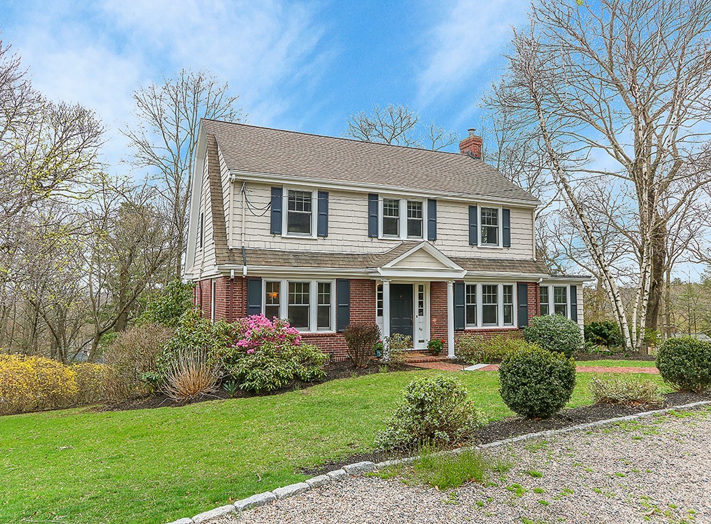 46 Greylock Road Newton, MA 02465 - Photo 2 of 25 a front view of a house with a yard and potted plants