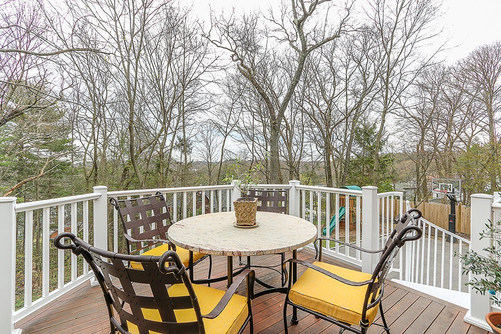 46 Greylock Road Newton, MA 02465 - Photo 22 of 25 a view of a table and chairs on the roof deck