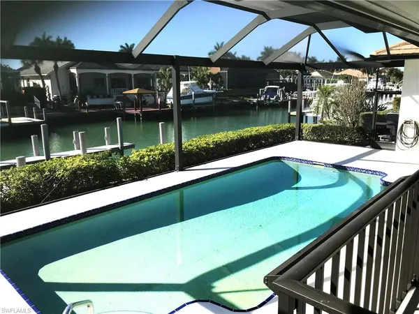 a view of swimming pool from a balcony