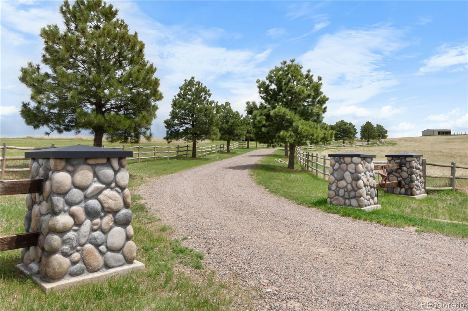 74 Rocky Cliff Road Elizabeth, CO 80107 - Photo 5 of 50 a view of a yard with wooden fence