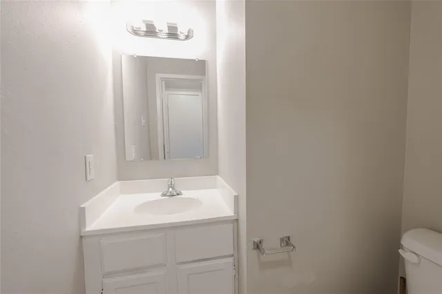 a bathroom with a sink and a vanity