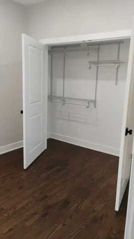 an empty room with wooden floor