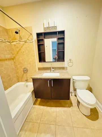 a bathroom with a sink a toilet and bathtub