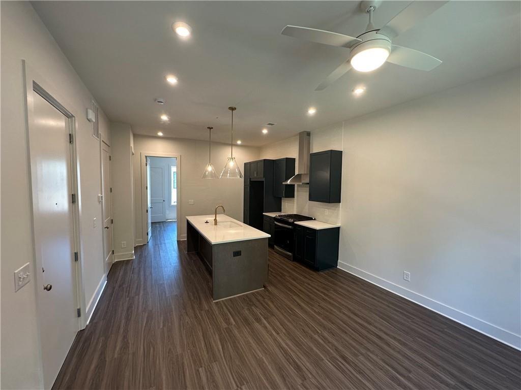 962 Bibb Street Northwest, Unit 6 Atlanta, GA 30318 - Photo 5 of 14 a view of kitchen with sink and refrigerator
