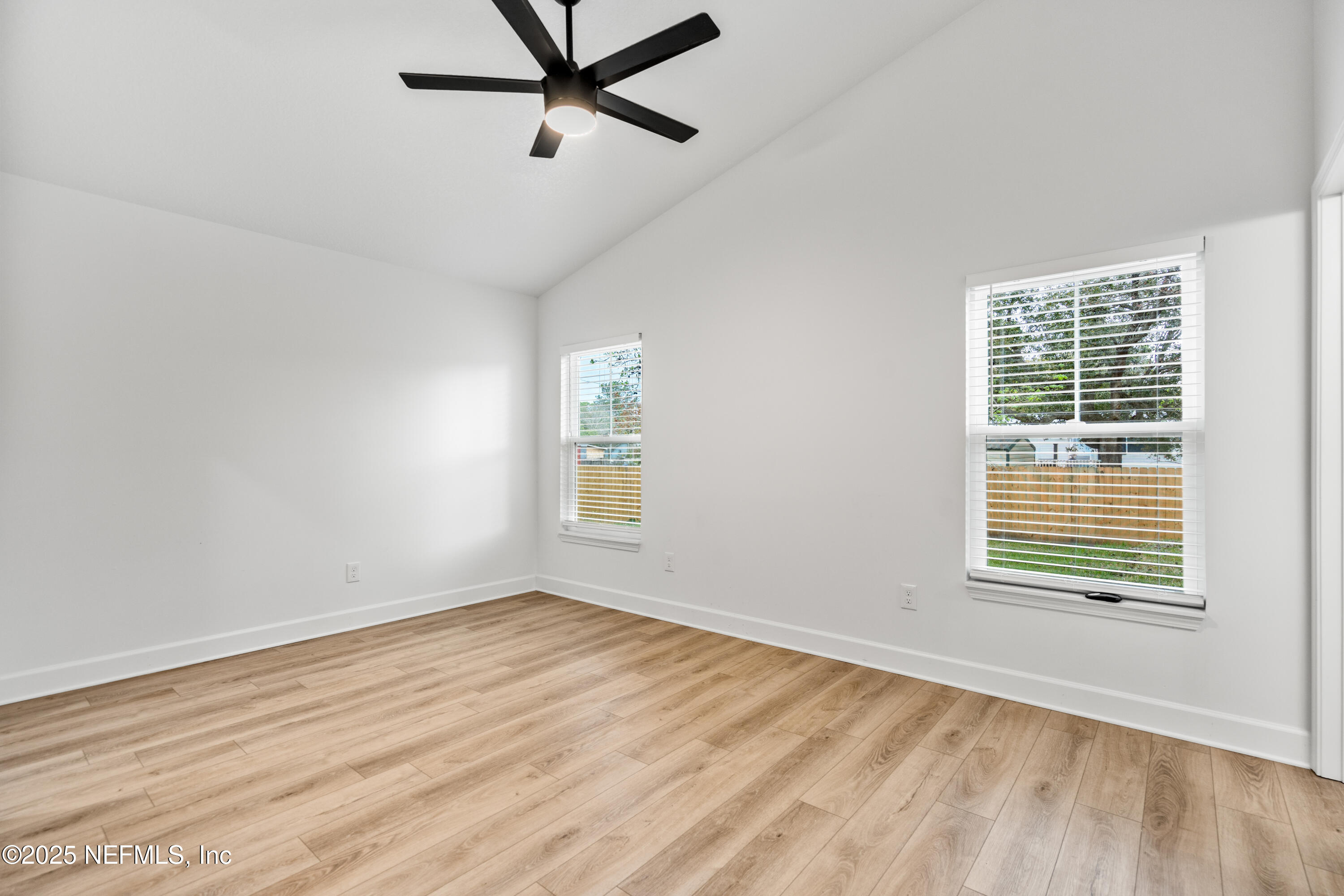 4532 Fourth Avenue St. Augustine, FL 32095 - Photo 16 of 24 a view of an empty room with wooden floor and a window