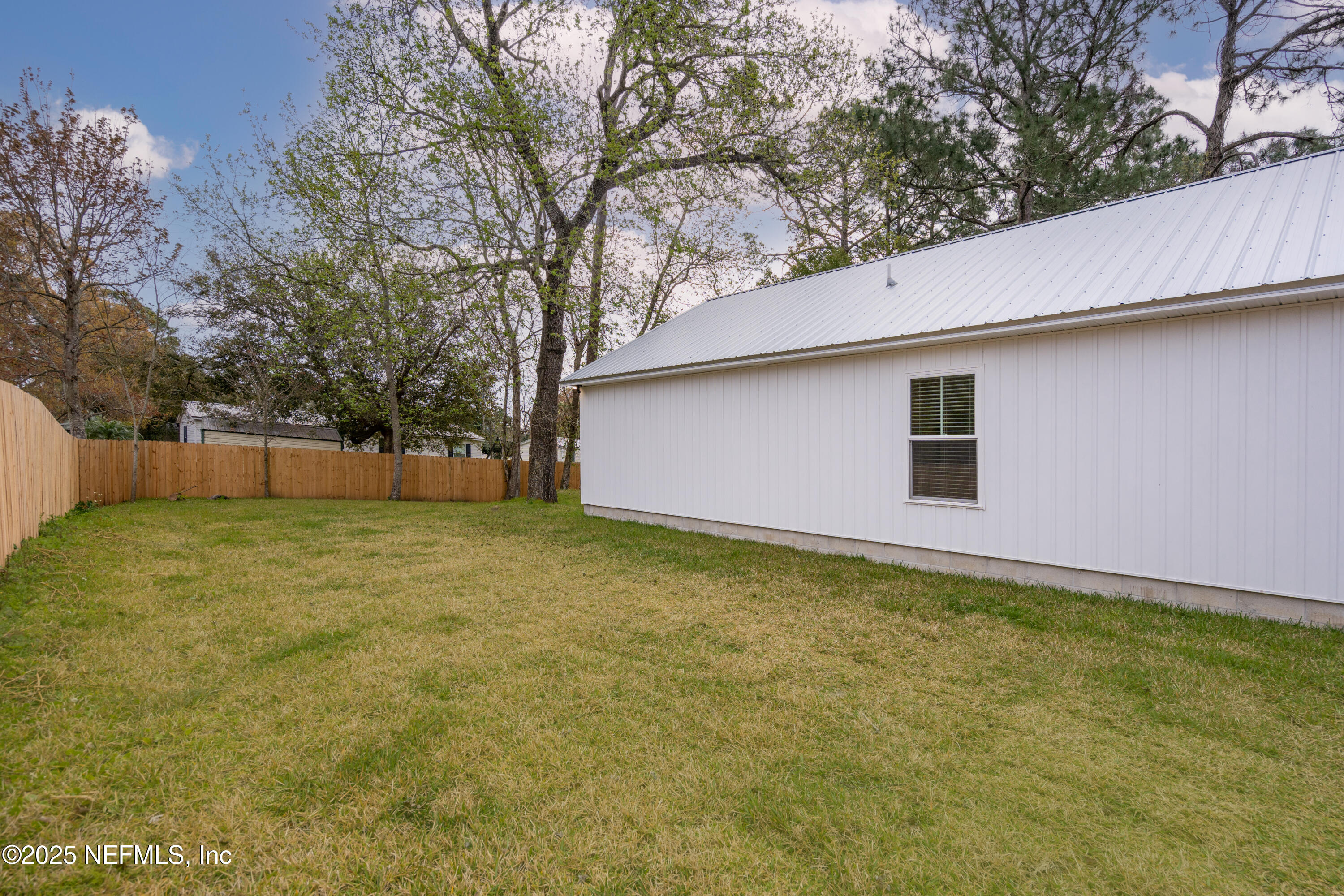 4532 Fourth Avenue St. Augustine, FL 32095 - Photo 24 of 24 a backyard of a house with lots of green space