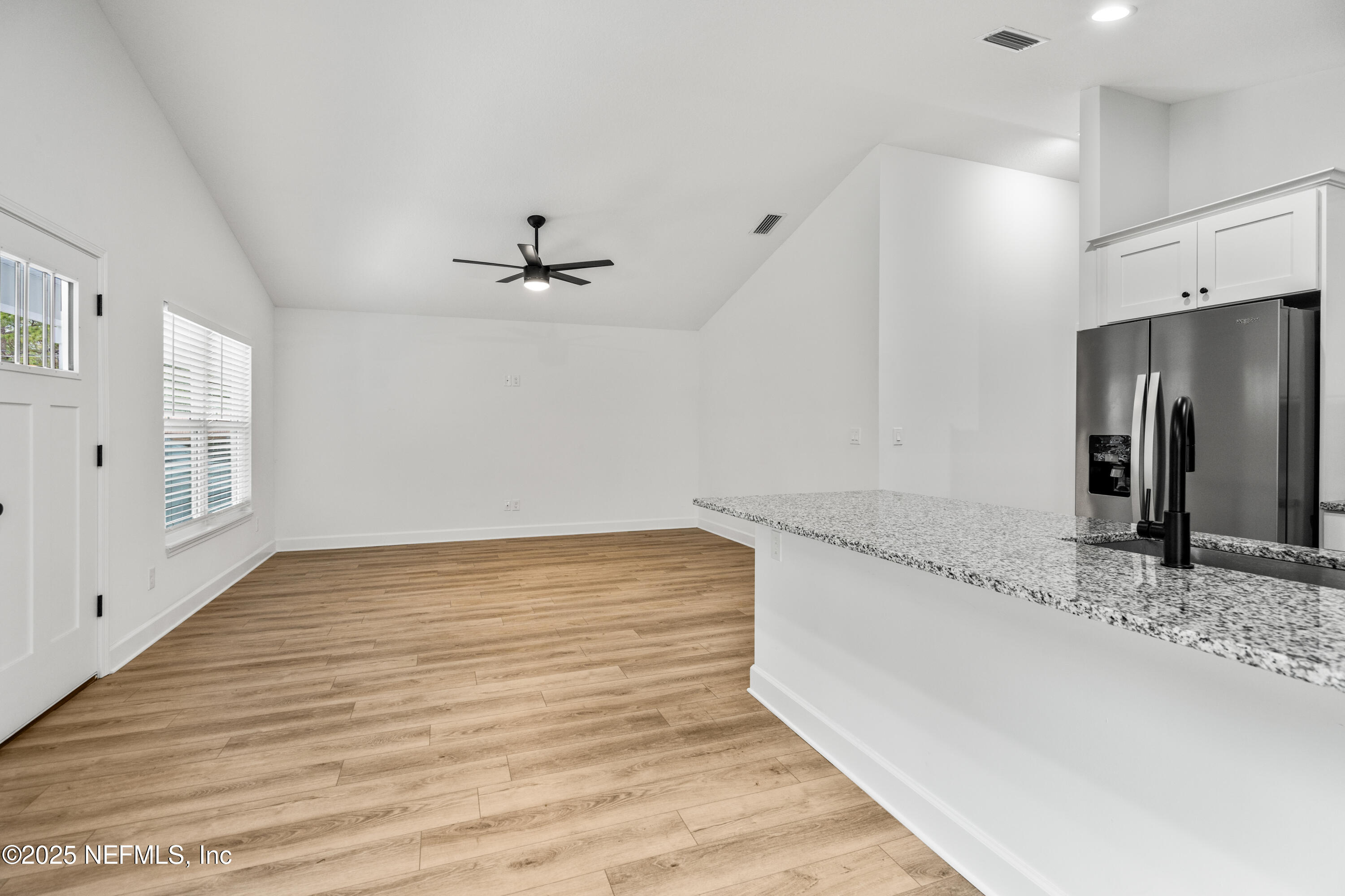 4532 Fourth Avenue St. Augustine, FL 32095 - Photo 9 of 24 a view of a kitchen with a sink and refrigerator