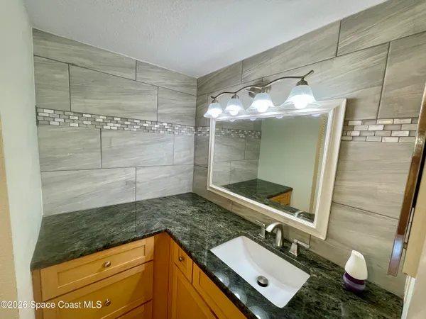 a bathroom with a shower and toilet