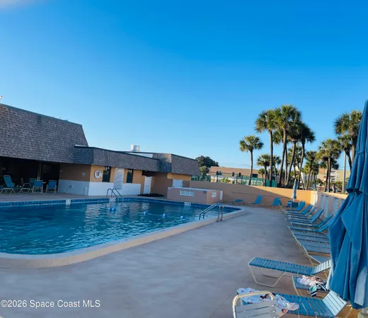 a view of a swimming pool with a garden