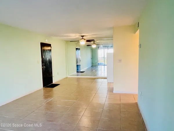 a view of a hallway with a chandelier