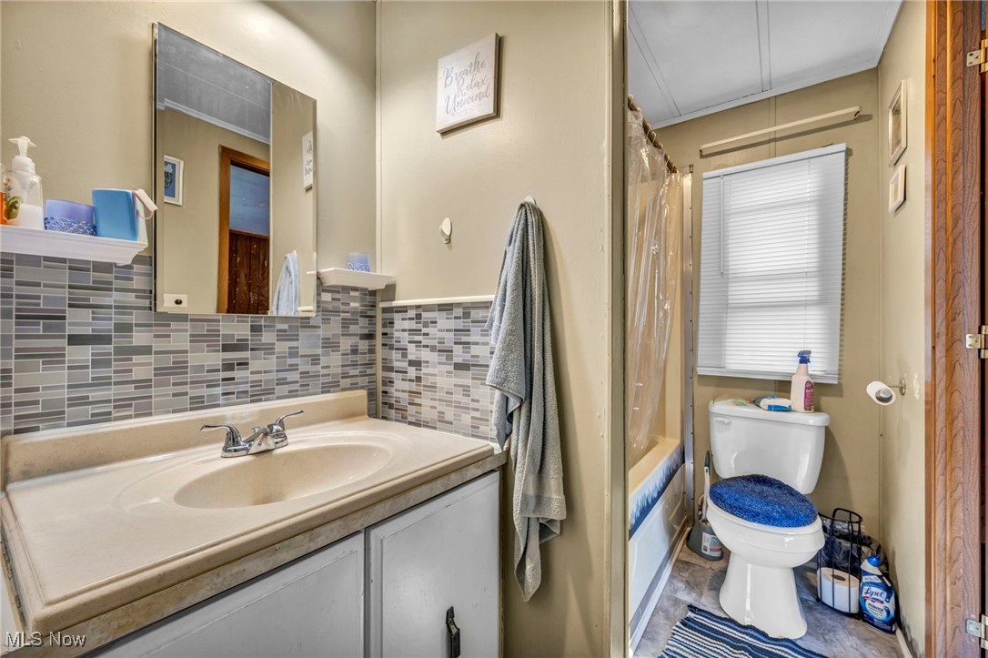 35157 Center Ridge Road, Unit 126 North Ridgeville, OH 44039 - Photo 17 of 50 Full bath featuring vanity, decorative backsplash, and shower / tub combo