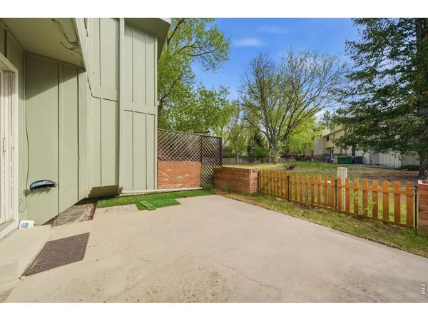 a backyard of a house with wooden floor