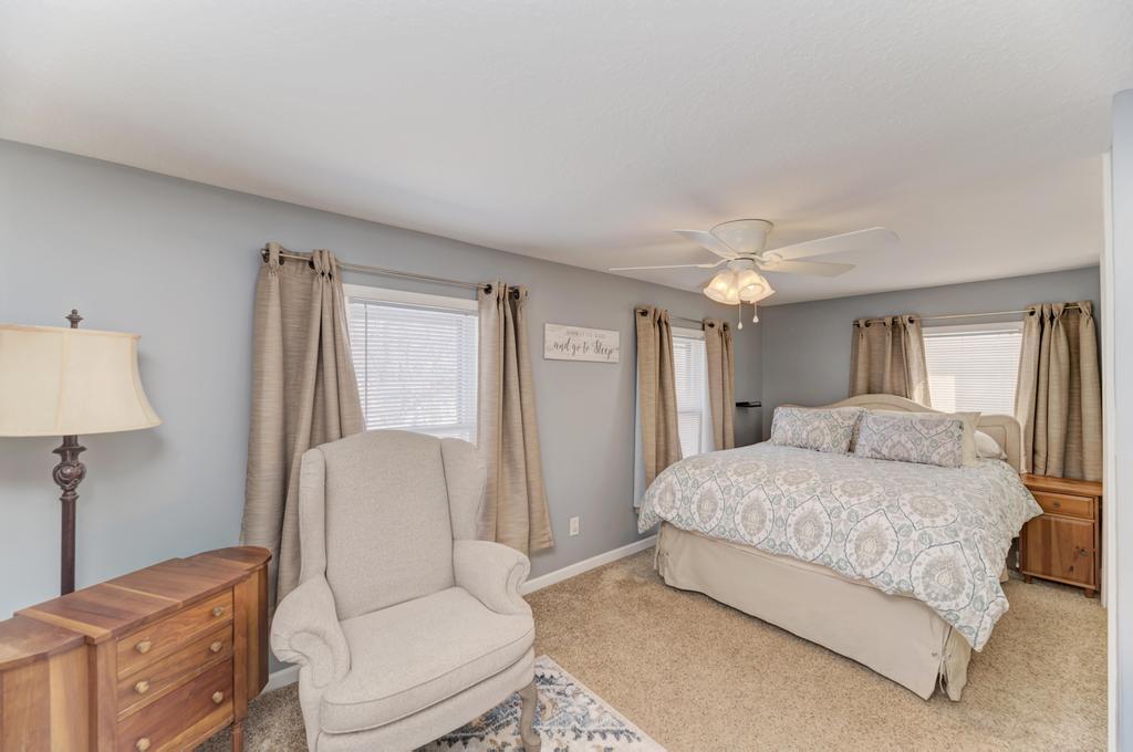 33709 West River Road Wilmington, IL 60481 - Photo 12 of 28 a spacious bedroom with a bed and a couch