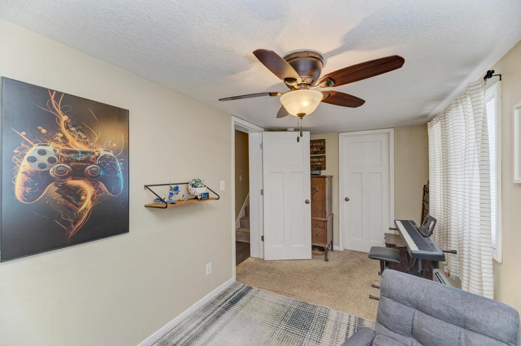 33709 West River Road Wilmington, IL 60481 - Photo 19 of 28 a bedroom with a bed and a chandelier