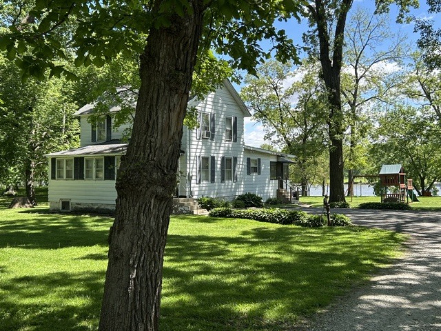 33709 West River Road Wilmington, IL 60481 - Photo 24 of 28 a view of a house with a yard