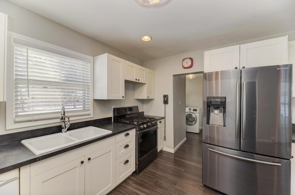 33709 West River Road Wilmington, IL 60481 - Photo 9 of 28 a kitchen with granite countertop stainless steel appliances a refrigerator sink and cabinets