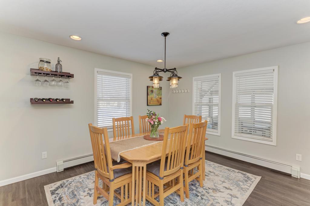 33709 West River Road Wilmington, IL 60481 - Photo 10 of 28 a view of a dining room with furniture wooden floor and chandelier
