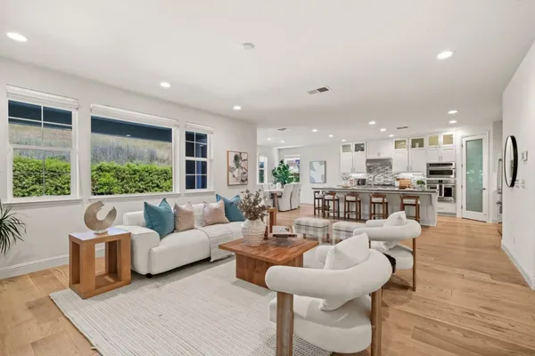 a living room with furniture fireplace and window