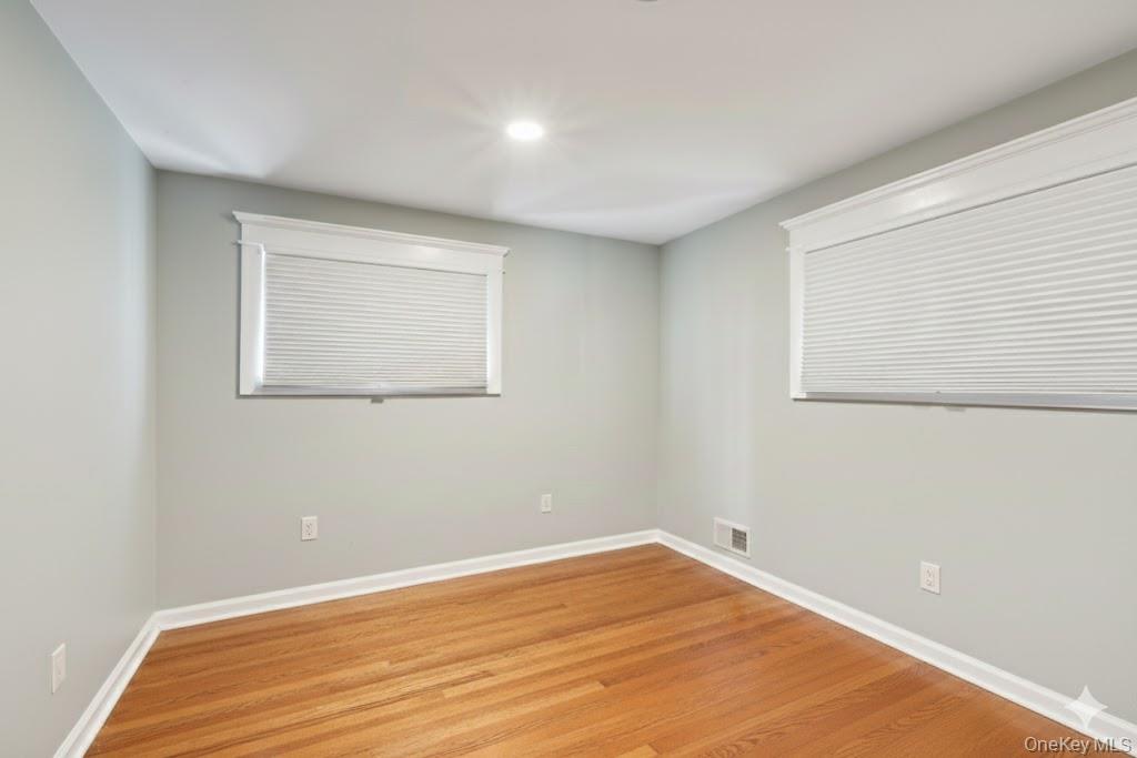 18 Lake Road Stony Point, NY 10980 - Photo 13 of 18 an empty room with wooden floor and windows