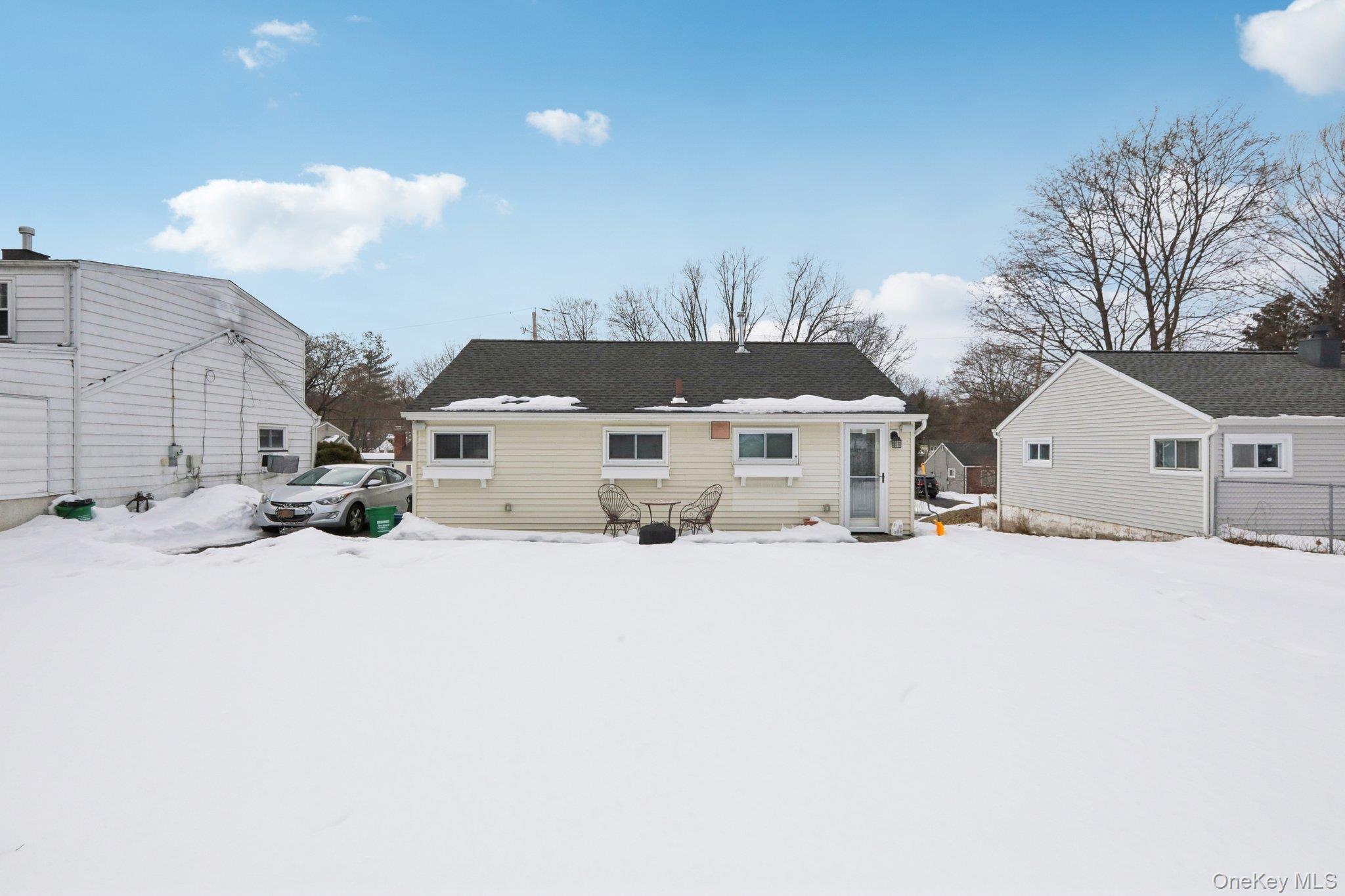 18 Lake Road Stony Point, NY 10980 - Photo 15 of 18 a front view of a house with a yard covered in snow