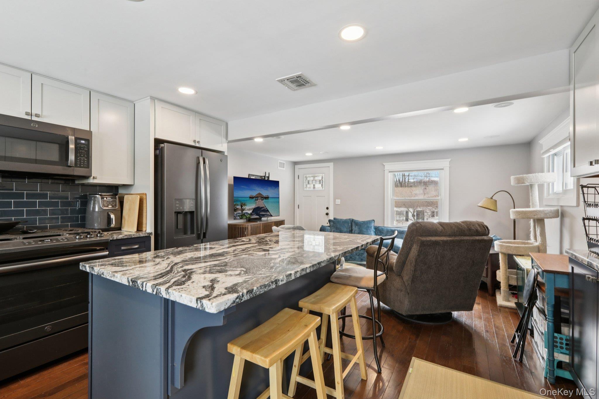 18 Lake Road Stony Point, NY 10980 - Photo 7 of 18 a kitchen with stainless steel appliances granite countertop a refrigerator and a stove