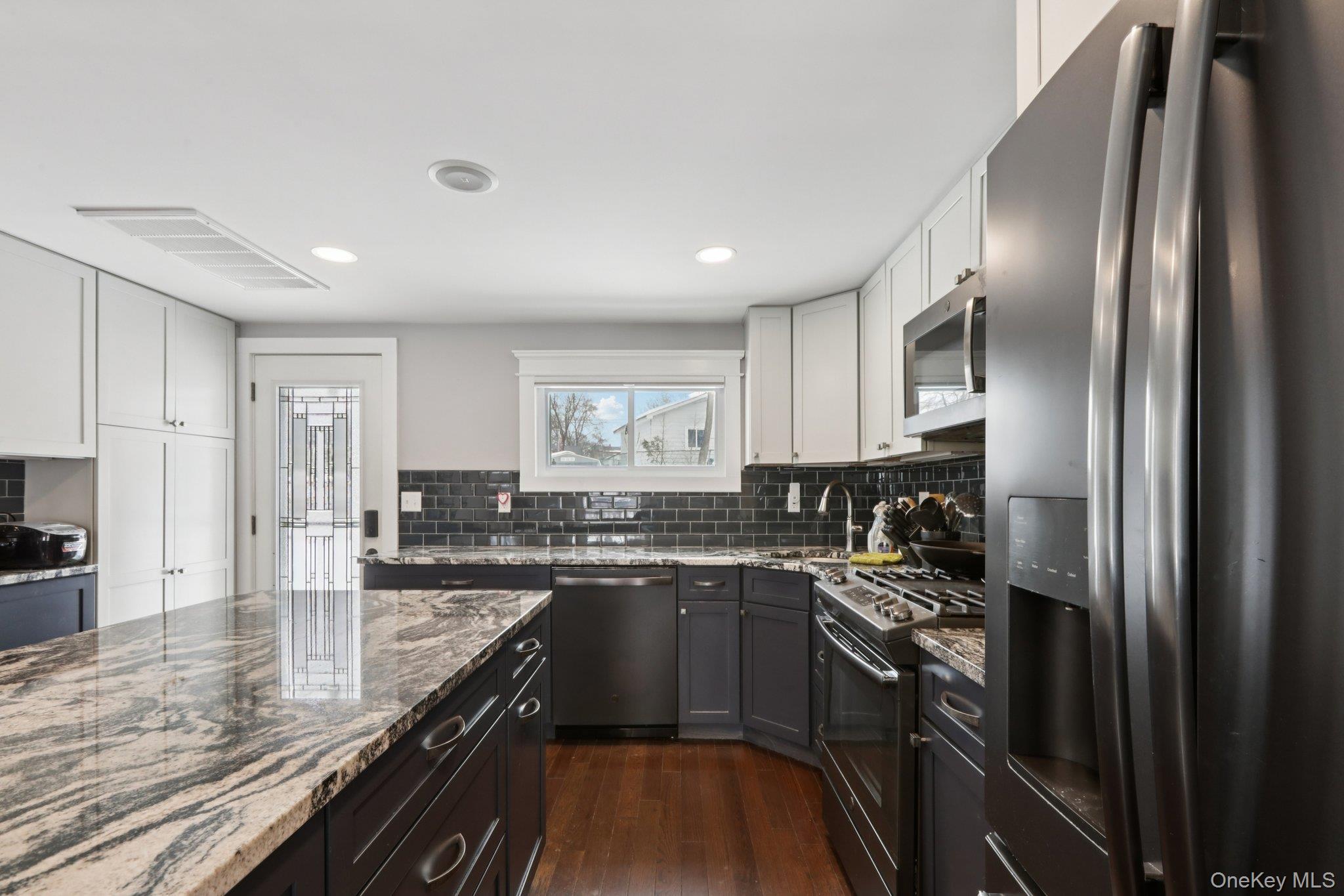18 Lake Road Stony Point, NY 10980 - Photo 8 of 18 a kitchen with granite countertop stainless steel appliances and wooden cabinets