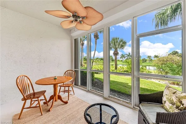 a view of a dining room with furniture window and outside view