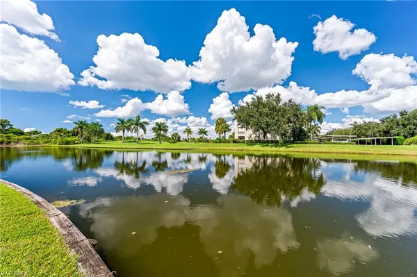 a view of a lake with a house in the background
