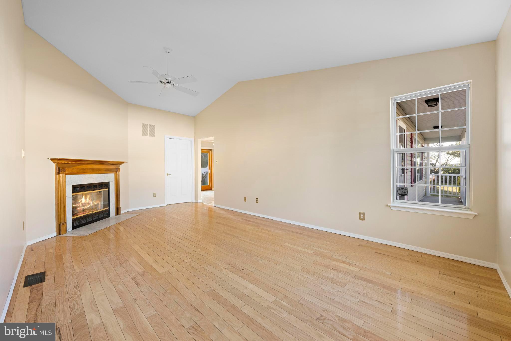 104 Greenwood Lake Road Little Egg Harbor, NJ 08087 - Photo 12 of 43 a view of empty room with wooden floor and fan