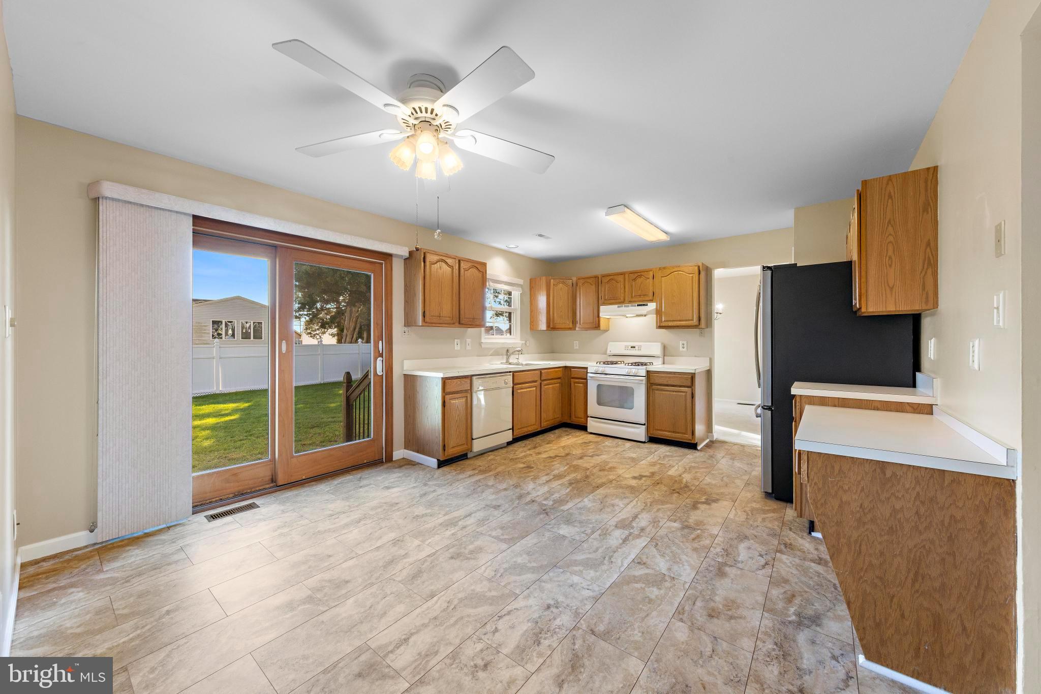 104 Greenwood Lake Road Little Egg Harbor, NJ 08087 - Photo 13 of 43 a view of a kitchen with a sink cabinets and entryway