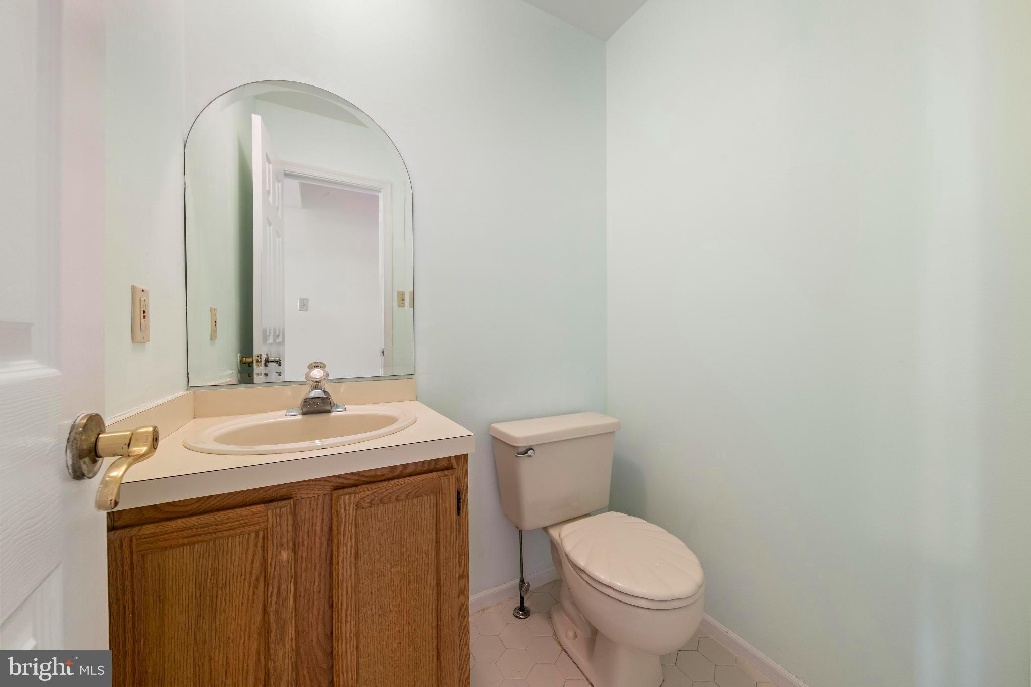 104 Greenwood Lake Road Little Egg Harbor, NJ 08087 - Photo 22 of 43 a bathroom with a toilet sink and mirror