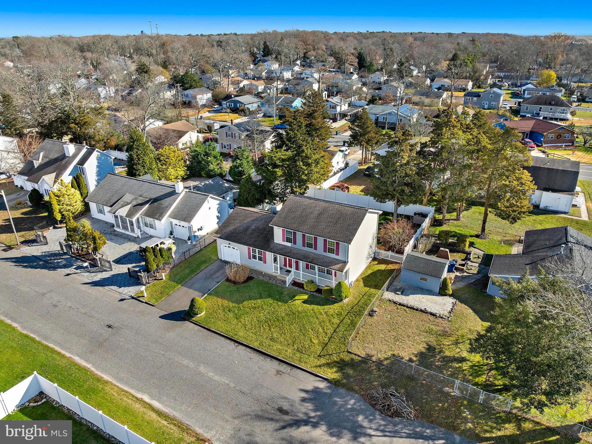 104 Greenwood Lake Road Little Egg Harbor, NJ 08087 - Photo 39 of 43 an aerial view of a house with a yard and lake view