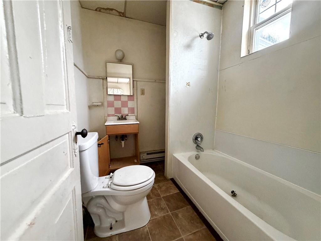 3027 Stayton Street Pittsburgh, PA 15212 - Photo 13 of 17 a bathroom with a bathtub toilet and sink