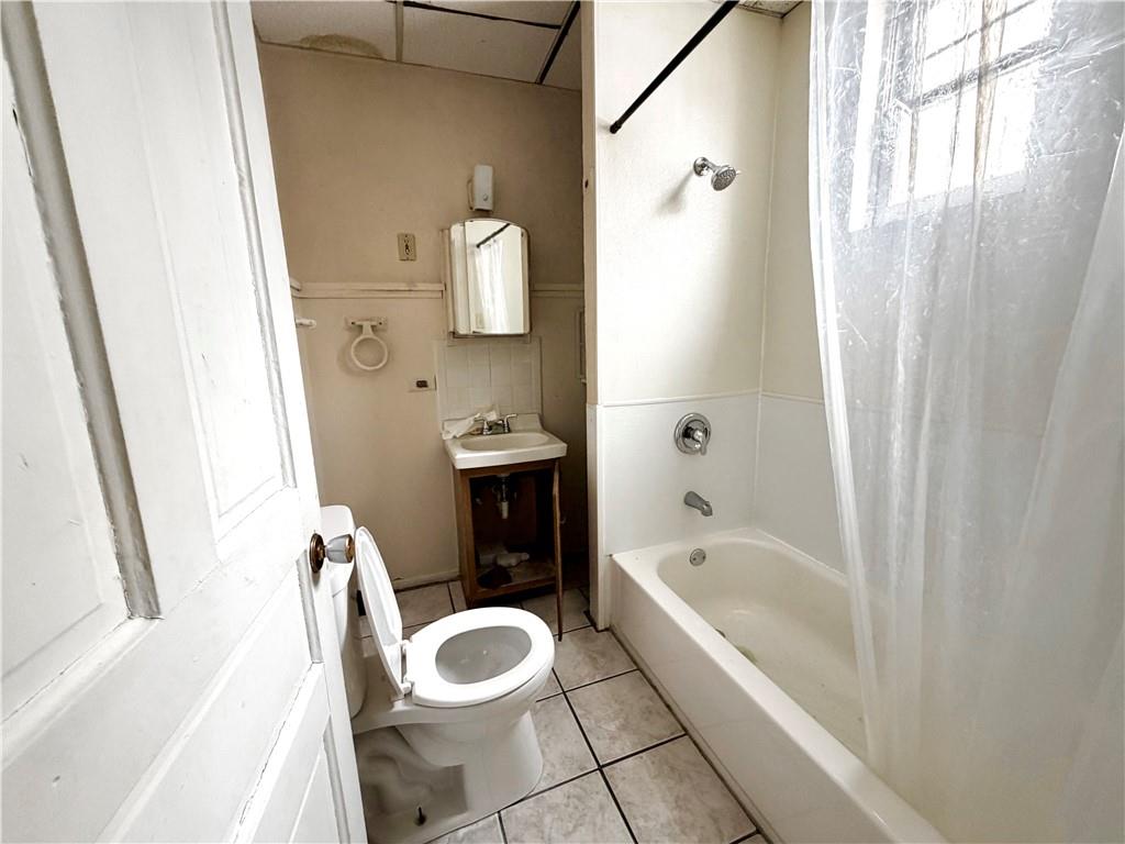 3027 Stayton Street Pittsburgh, PA 15212 - Photo 7 of 17 a bathroom with a sink a toilet and bathtub