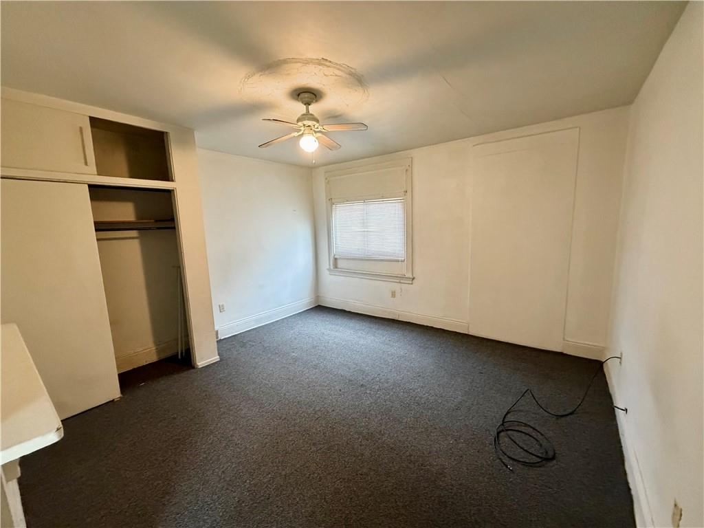 3027 Stayton Street Pittsburgh, PA 15212 - Photo 8 of 17 a view of a livingroom with wooden floor and a ceiling fan