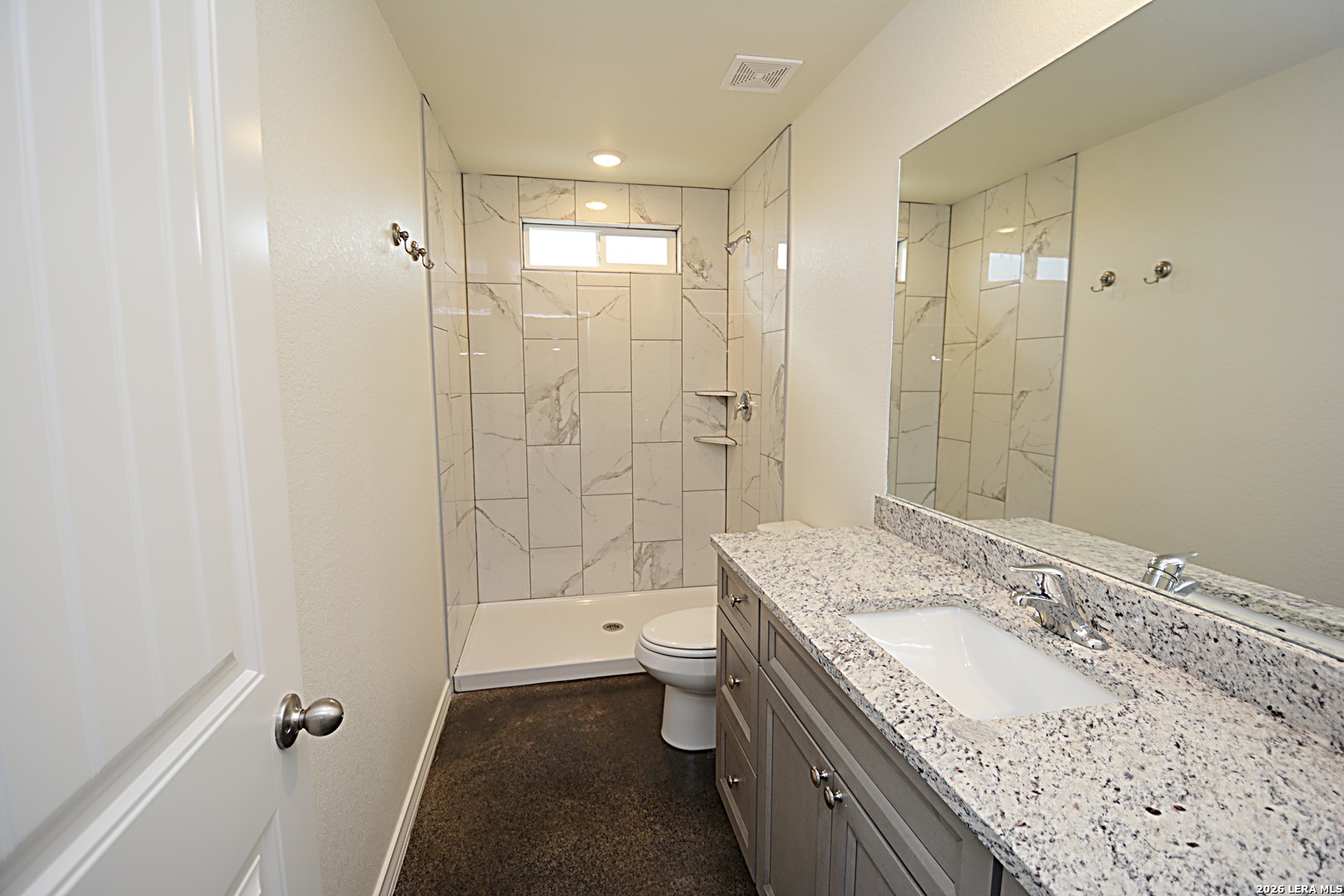 1559 Golf Course Drive Spring Branch, TX 78070 - Photo 11 of 15 a bathroom with a granite countertop sink a toilet and shower