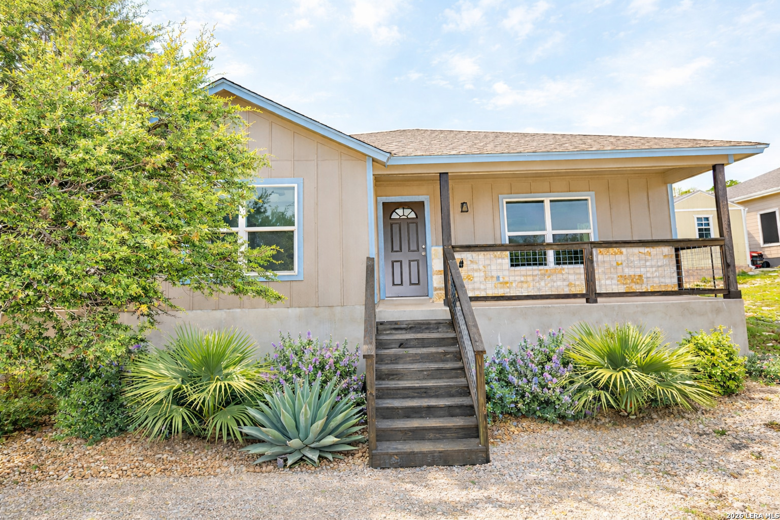 1559 Golf Course Drive Spring Branch, TX 78070 - Photo 2 of 15 a view of a house with a small yard plants and large tree