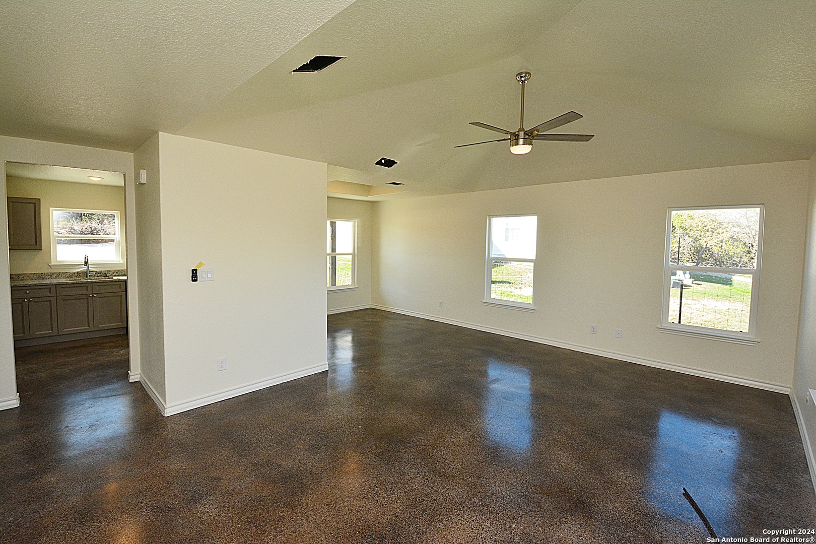 1559 Golf Course Drive Spring Branch, TX 78070 - Photo 2 of 8 wooden floor in an empty room with a window