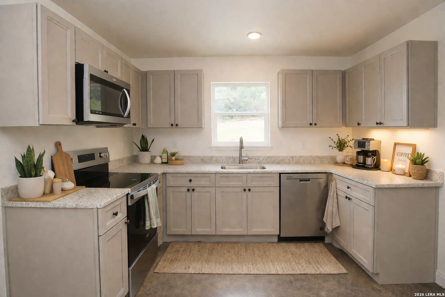 1559 Golf Course Drive Spring Branch, TX 78070 - Photo 6 of 15 a kitchen with a sink stove and microwave