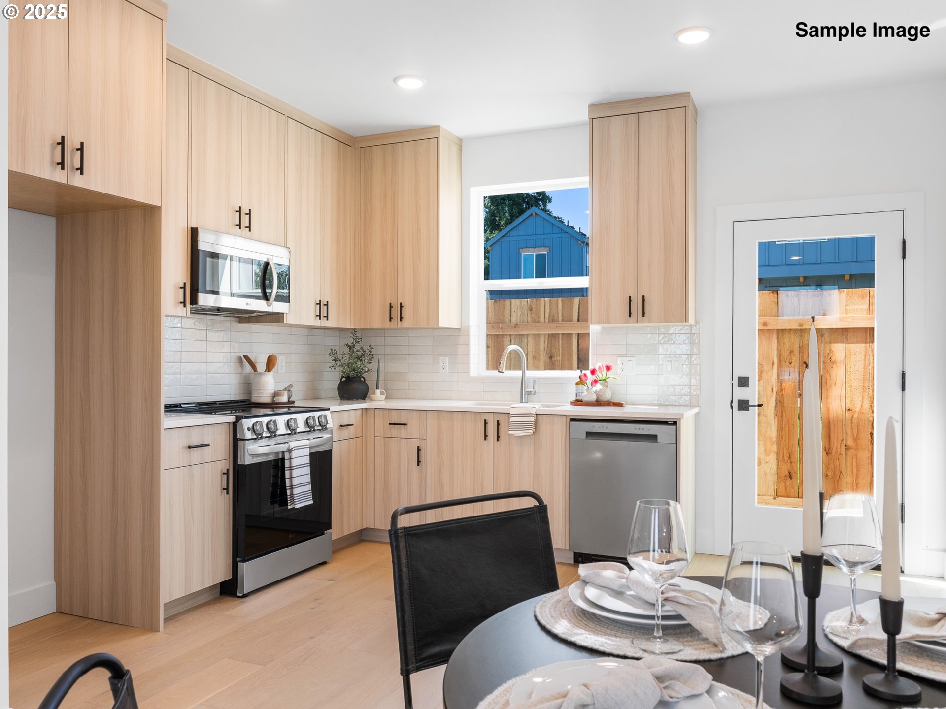 4350 Northeast Going Street Portland, OR 97218 - Photo 5 of 15 a kitchen with a refrigerator and a stove top oven