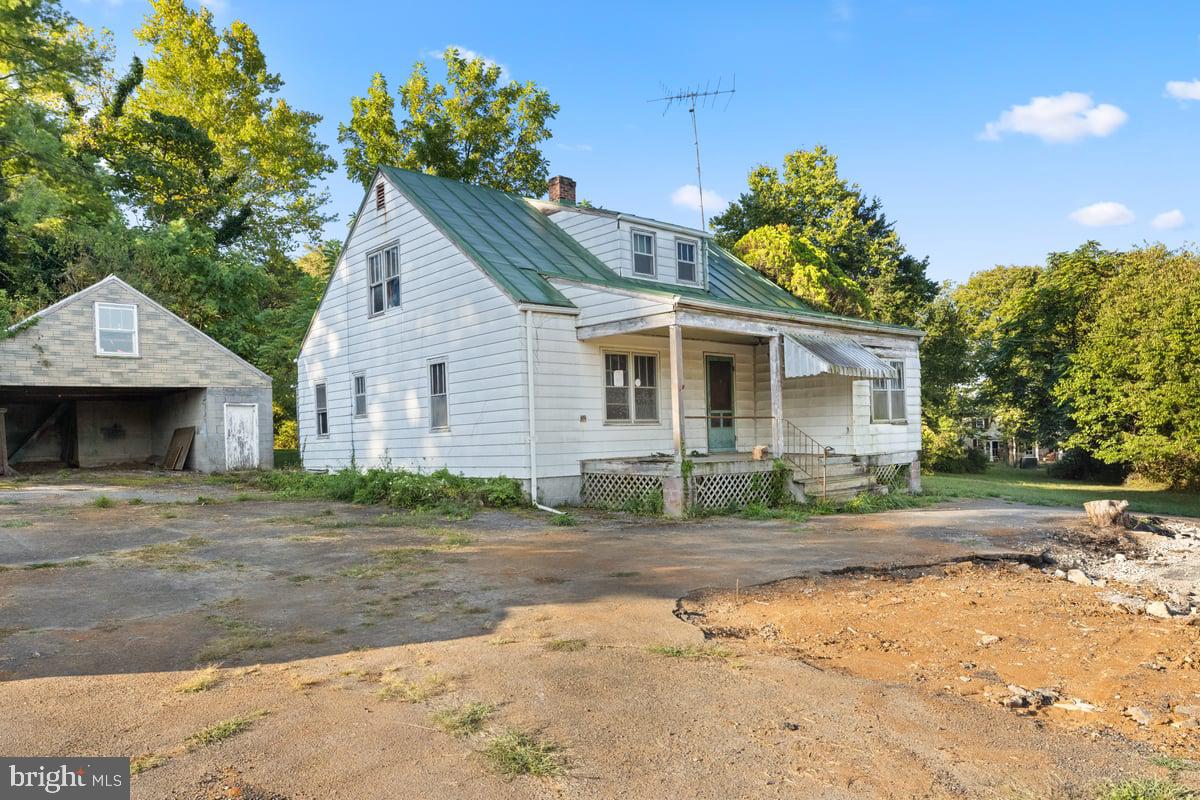 7189 Middle Road Middletown, VA 22645 - Photo 1 of 30 a front view of a house with a yard and a garage