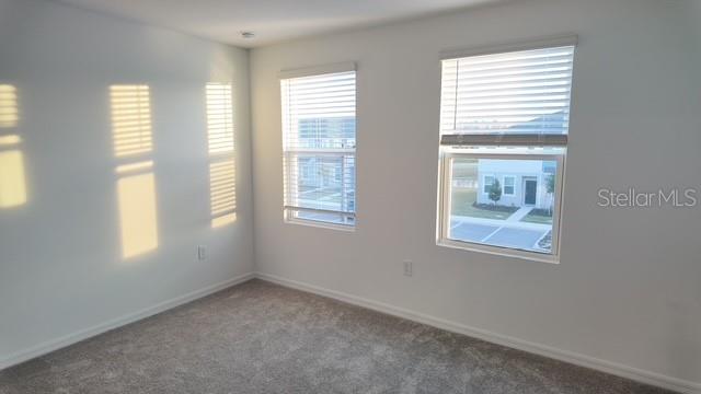 3240 Skyline Loop Kissimmee, FL 34758 - Photo 13 of 26 a view of an empty room with a window