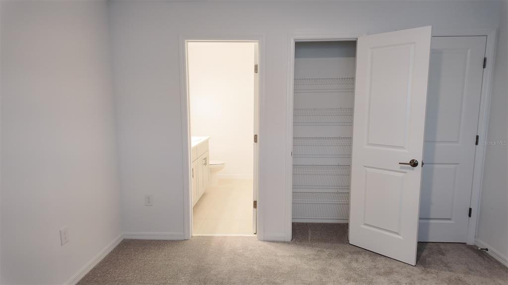 3240 Skyline Loop Kissimmee, FL 34758 - Photo 14 of 26 an empty room with closet