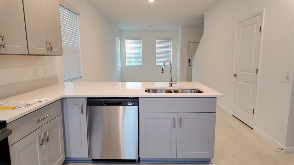 3240 Skyline Loop Kissimmee, FL 34758 - Photo 2 of 26 a bathroom with a sink and a mirror