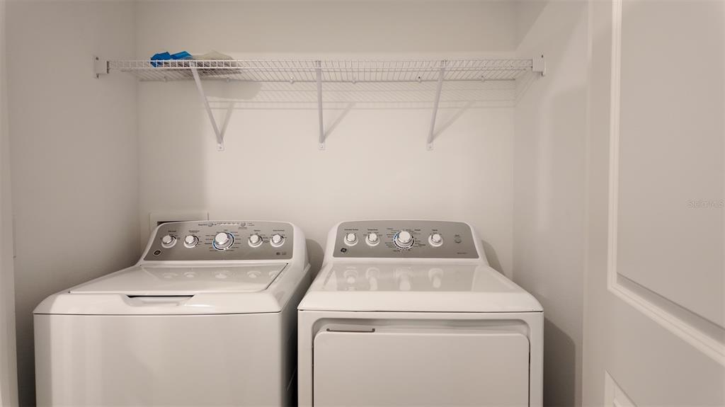 3240 Skyline Loop Kissimmee, FL 34758 - Photo 21 of 26 a utility room with dryer and washer