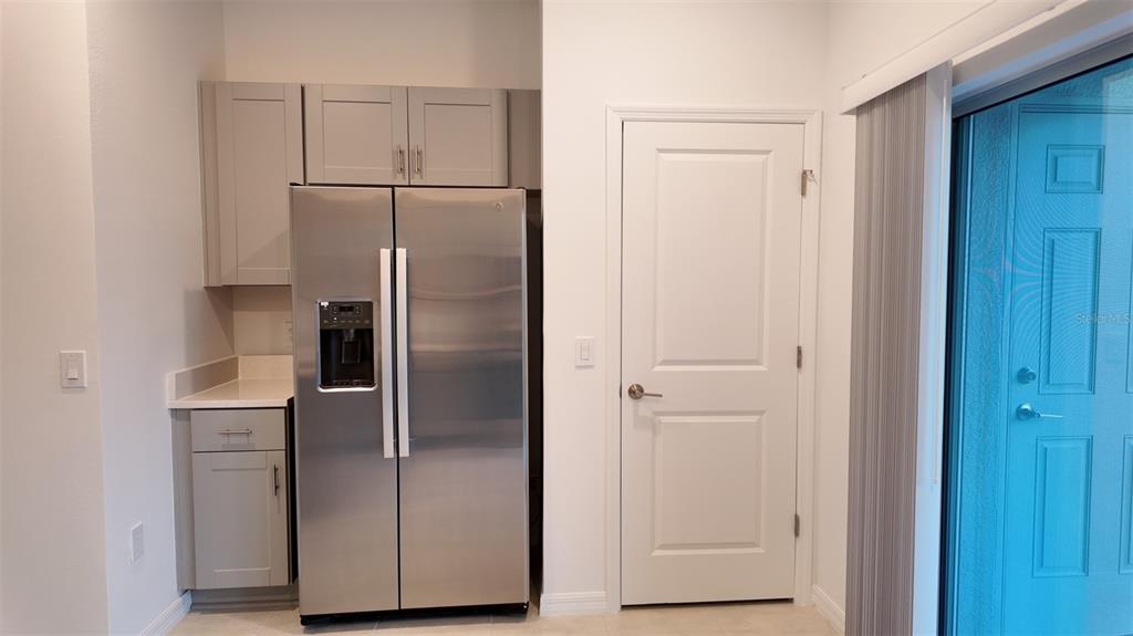 3240 Skyline Loop Kissimmee, FL 34758 - Photo 6 of 26 a view of kitchen with refrigerator and cabinet