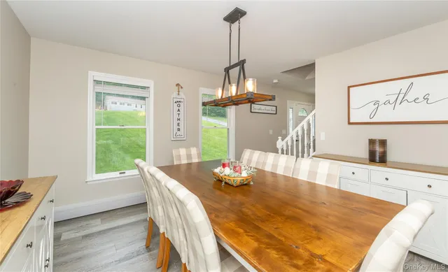a dining room with furniture and window