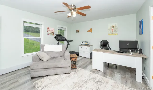 a living room with furniture and a window