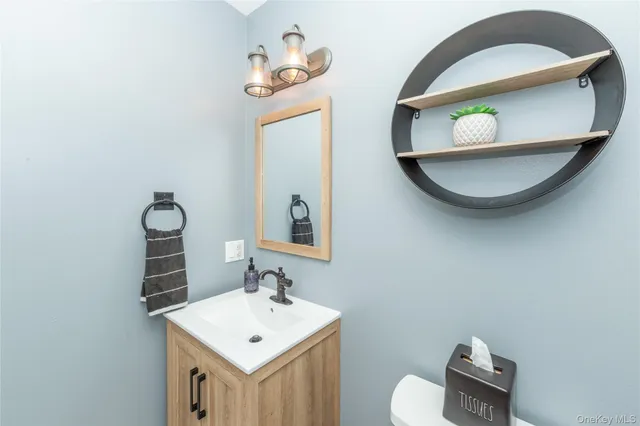a view of a hallway with wooden floor and entryway